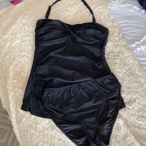 Black tankini with adjustable neck strap.
